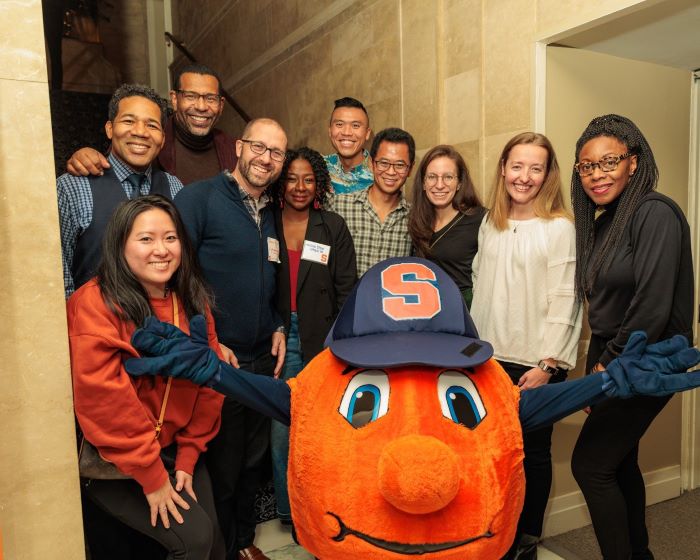 Alumni posing with Otto at Lubin House